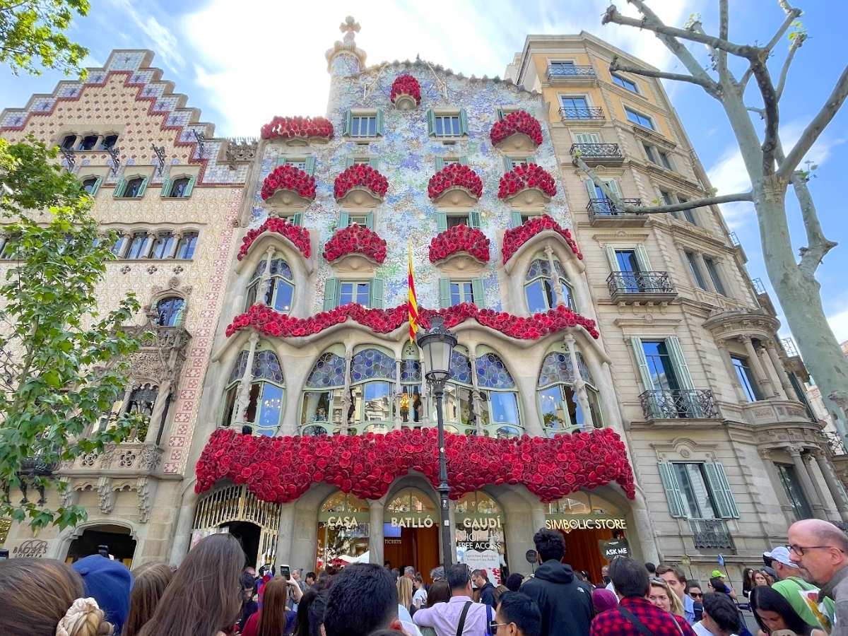 Casa Batlló in Barcelona decorated with red roses across its facade for Sant Jordi Day