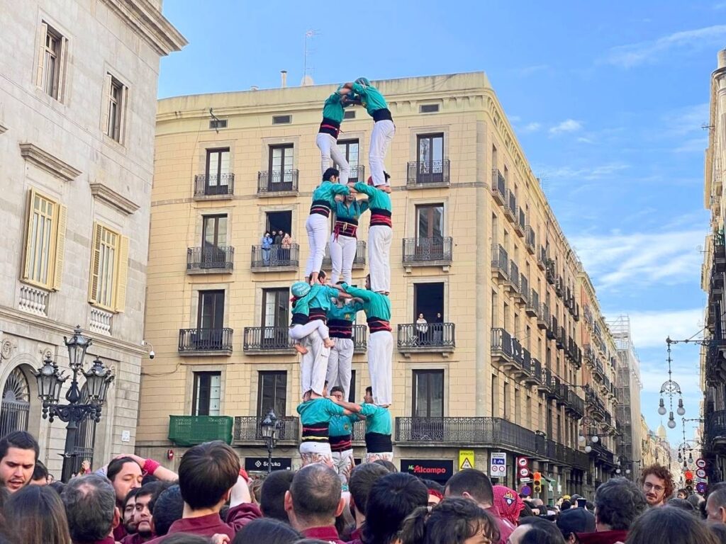 Castellers forming a traditional Catalan human tower in the streets of Barcelona during a local festival