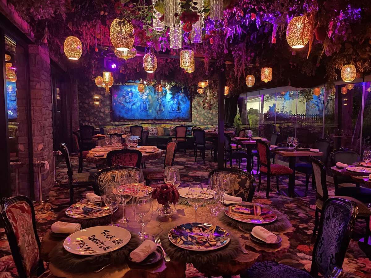 Tables and chairs with elaborate floral decor at La Petit Foret in Andorra