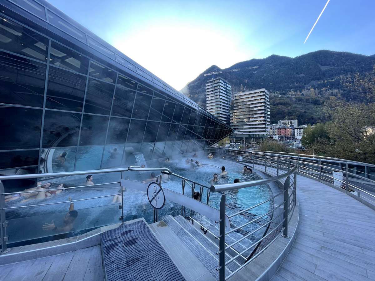 People swimming at outdoor pools at Caldea Spa Andorra