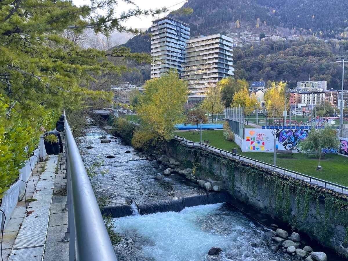 A river in Andorra La Vella with mountains in the background