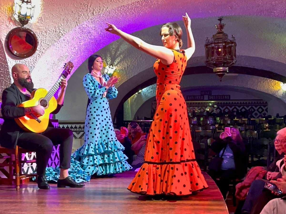 A female flamenco performer dancing on stage at Tablao Flamenco Cordobes Barcelona
