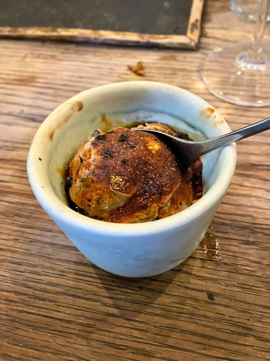 A bowl of salted chocolate mousse dessert at the Paella Club