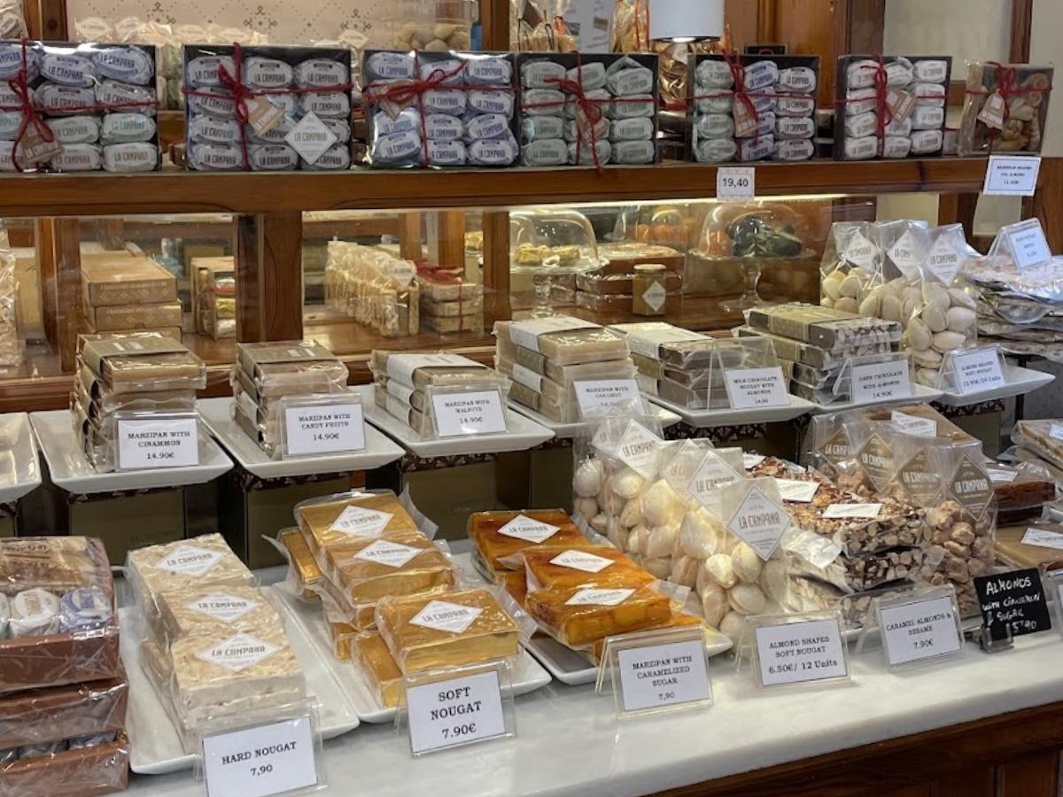 An assortment of different types of turron on display at a local shop in Spain