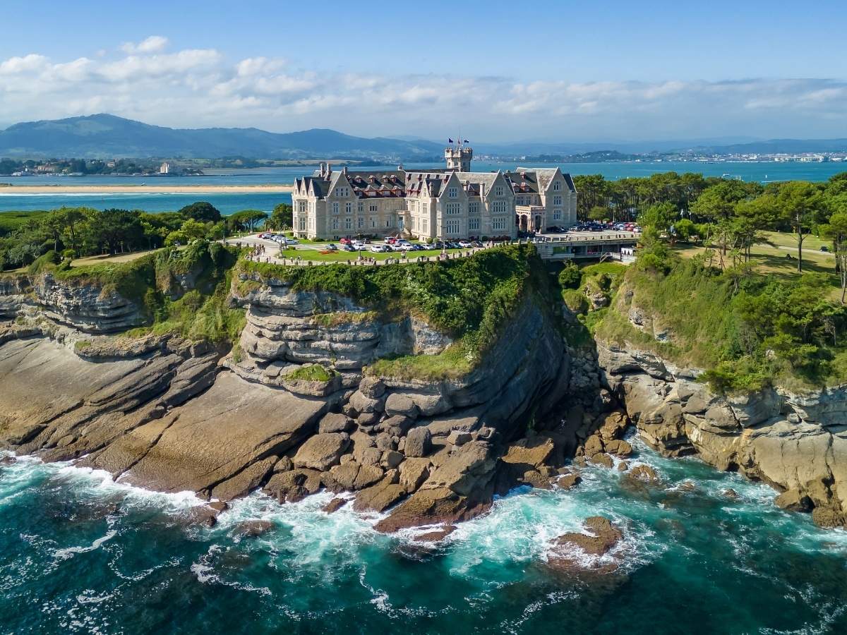 Palacio de la Magdalena overlooking the rocky coastline and sea in Santander Spain