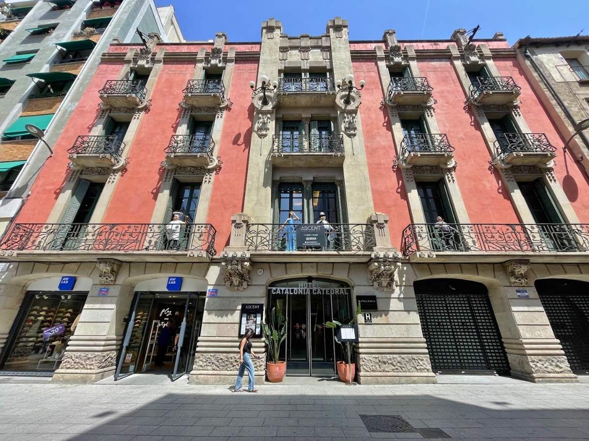 Exterior of Hotel Catalonia Catedral in Barcelona with historic facade and balconies on a busy shopping street