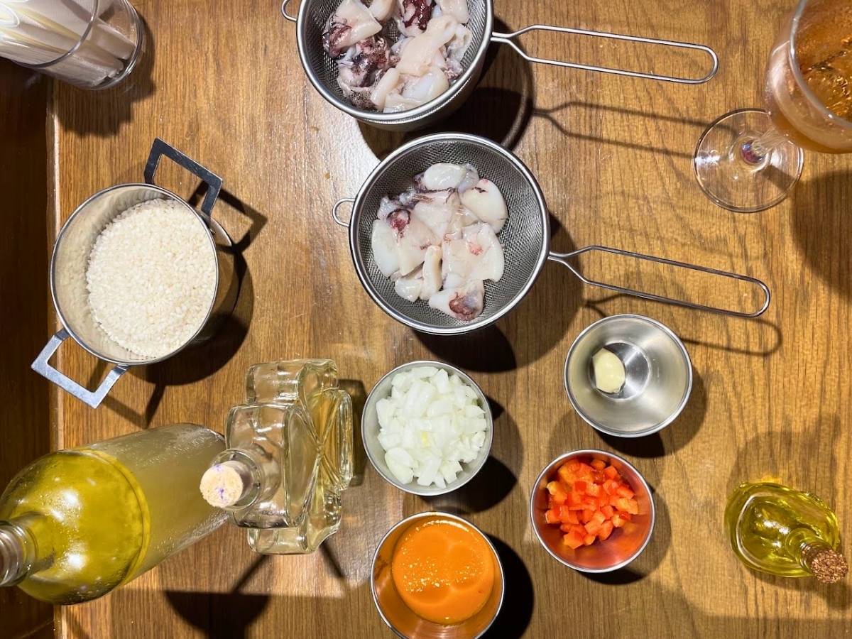 Pre-portioned rice, seafood, vegetables, and other paella ingredients at Rice to Meet You