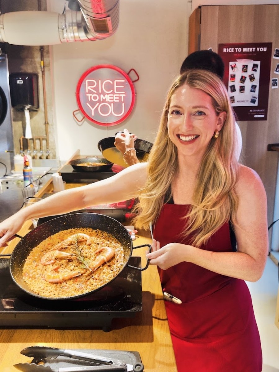 Me holding a homemade seafood paella during the Rice to Meet You Barcelona cooking class