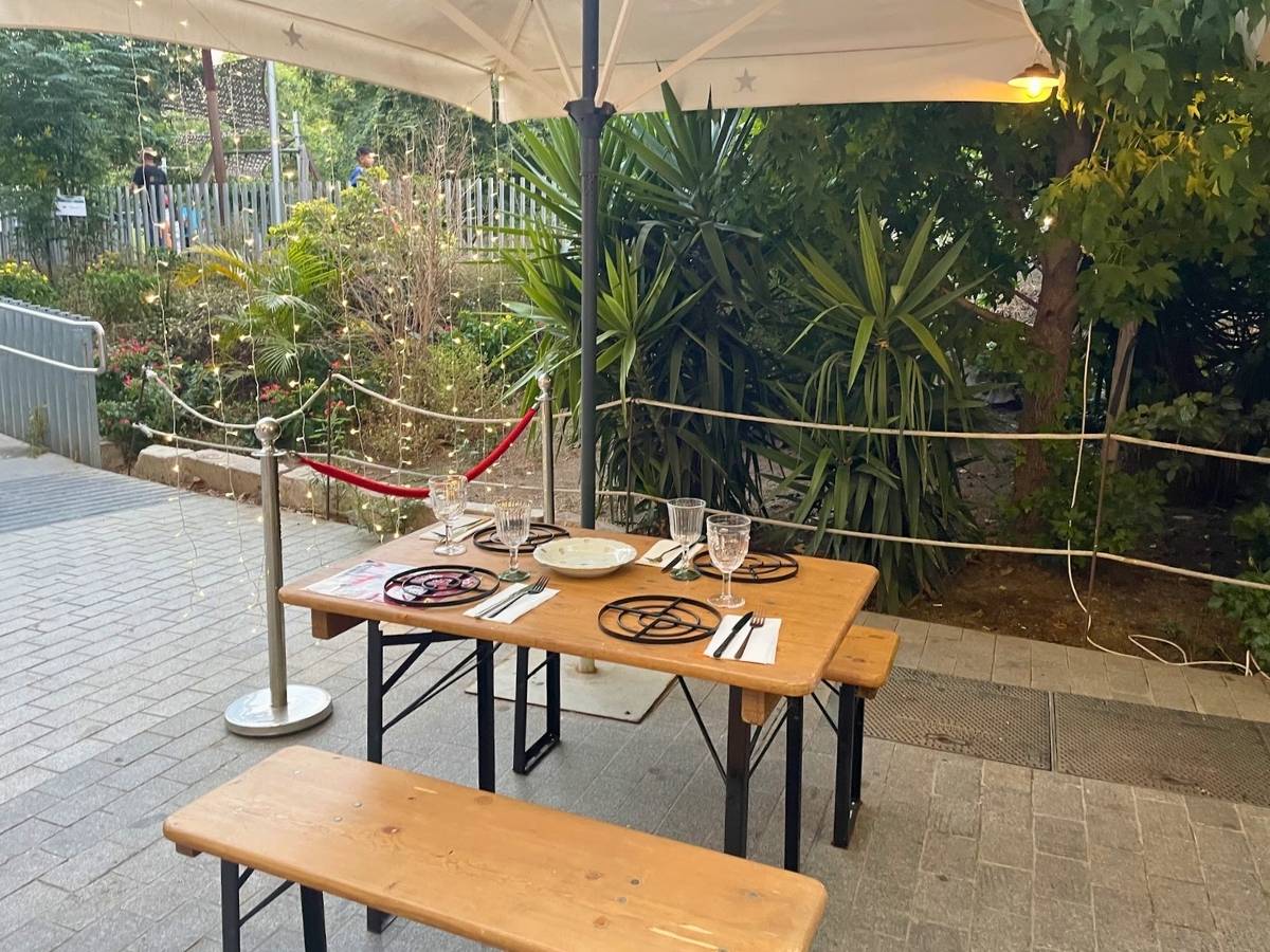 Outdoor patio at Rice to Meet You in Barcelona with tables set for dinner