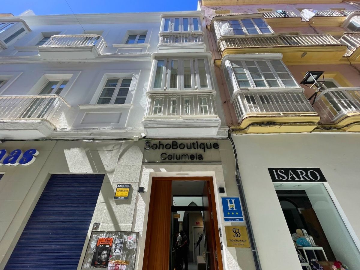 Exterior of Soho Boutique Columela hotel on a narrow street in Cádiz Old Town