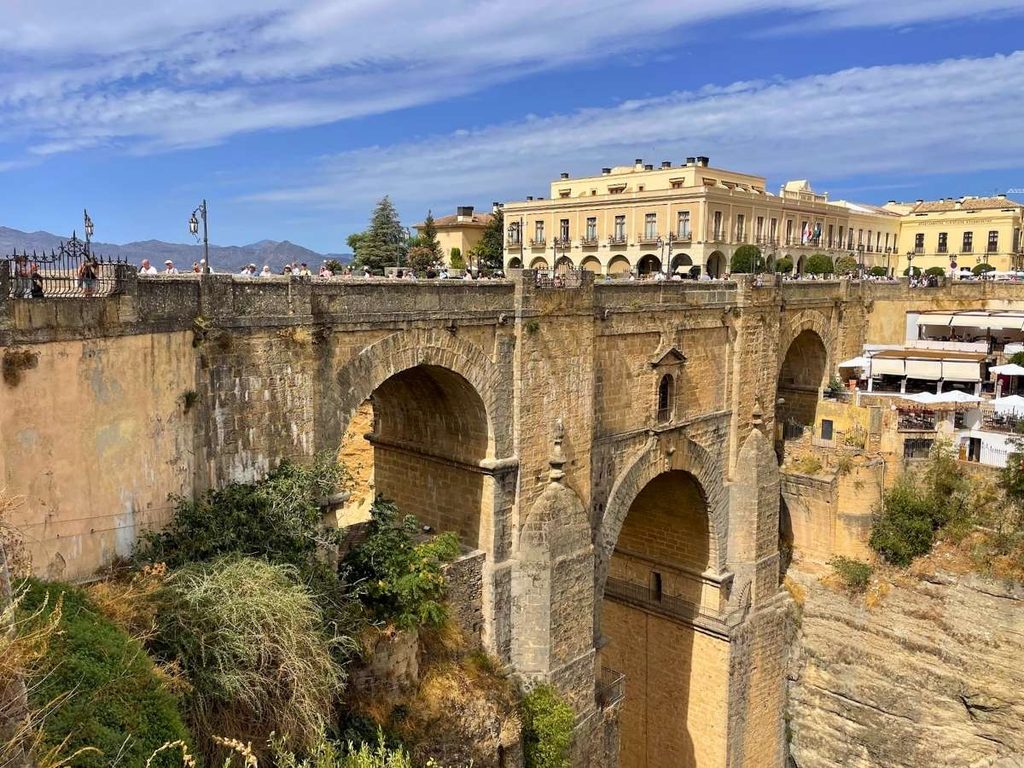 Close view of the stone arches of Puente Nuevo crossing El Tajo gorge in Ronda