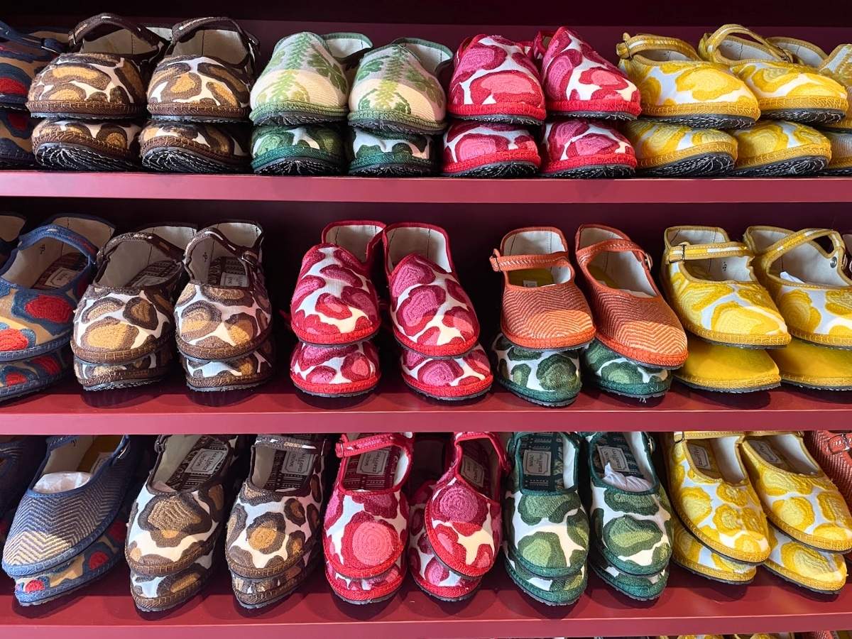 Colorful patterned slippers and flats displayed at the Cayumas store in Madrid