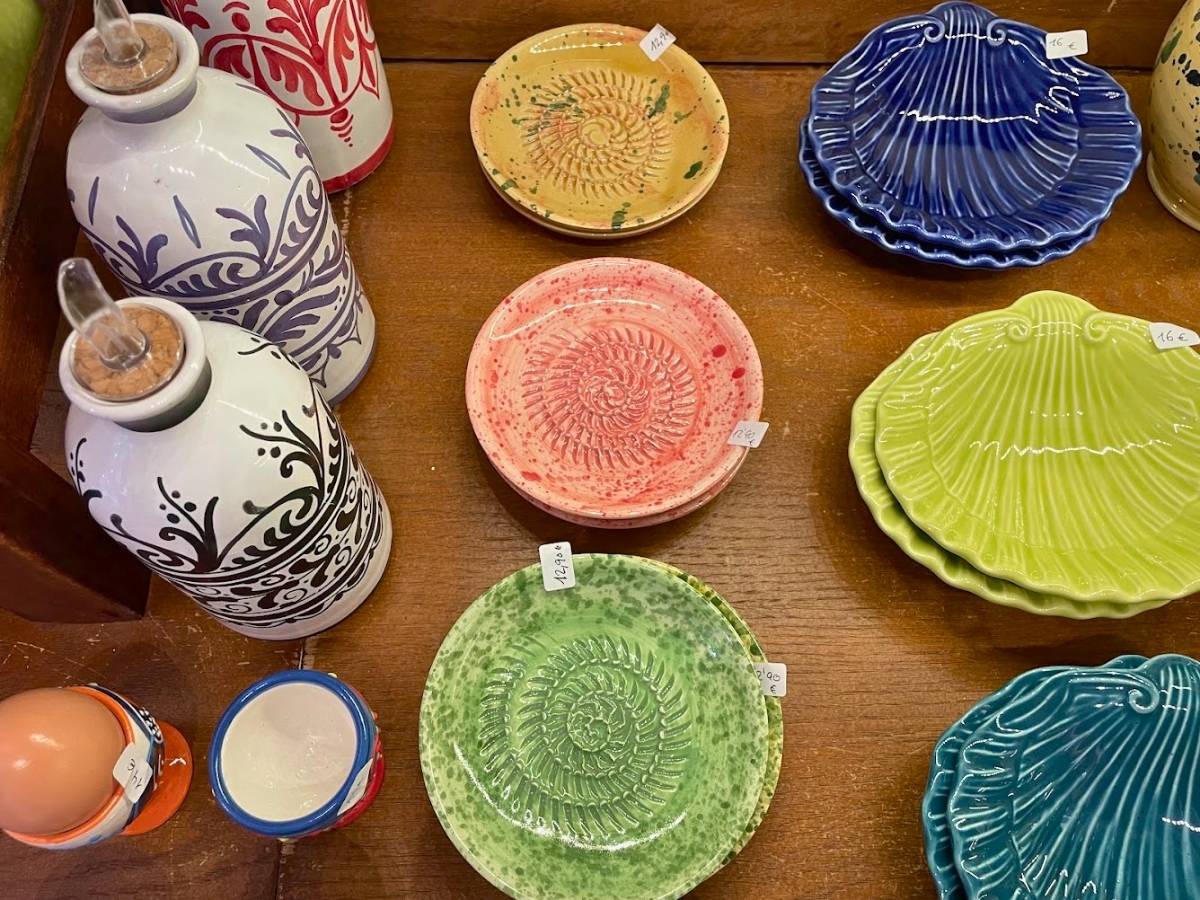 Colorful ceramic grater plates and olive oil dispensers on display at Morueco in Madrid