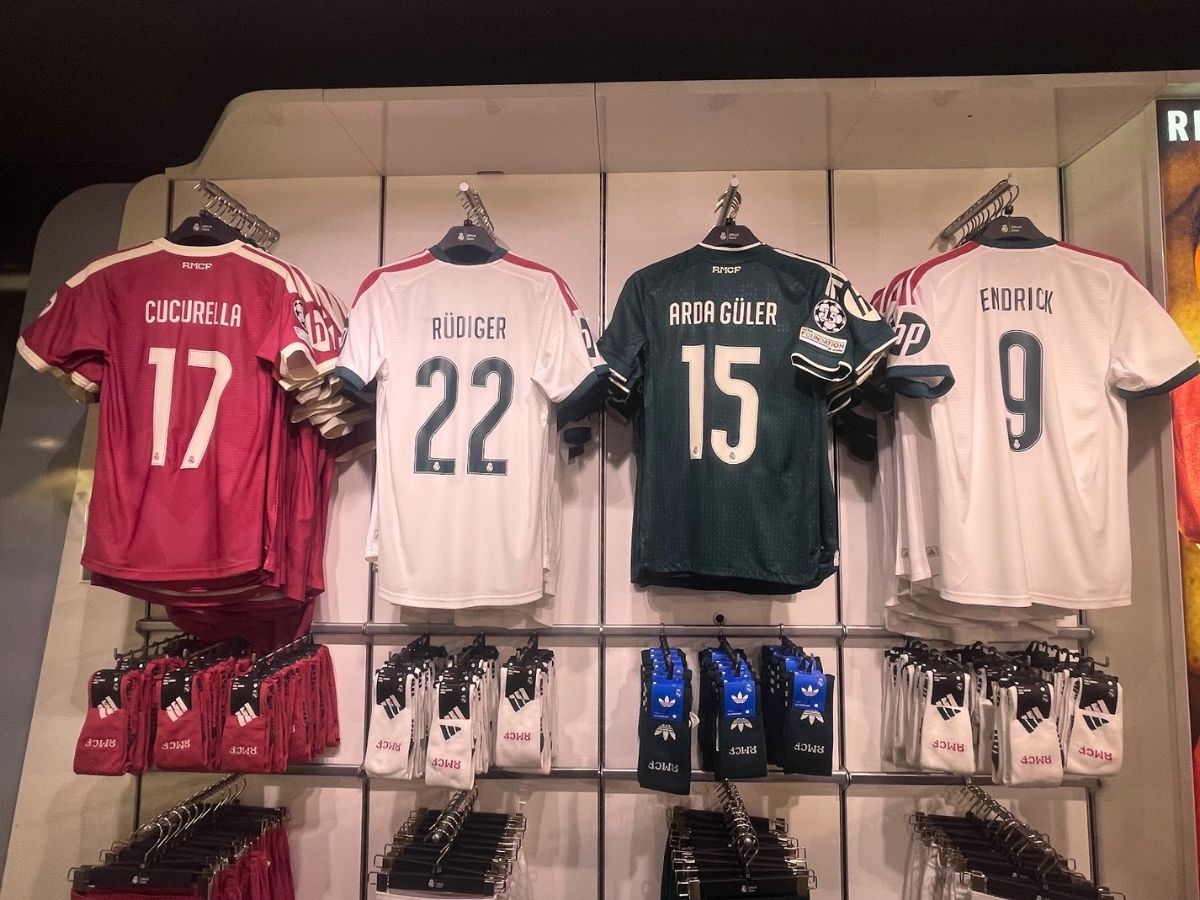 Real Madrid soccer jerseys and merchandise on display inside the official Real Madrid store