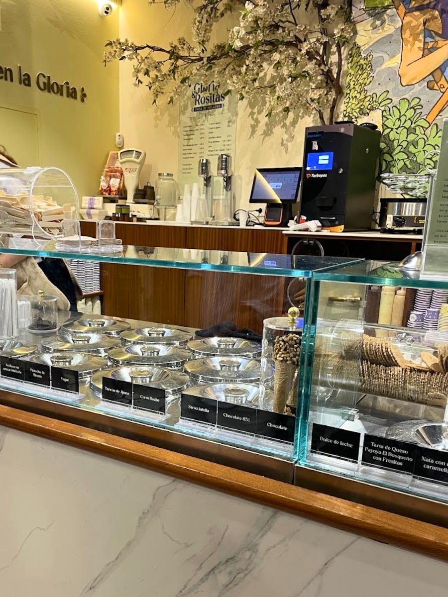 Ice cream display counter with a variety of gelato flavors at a shop in Seville